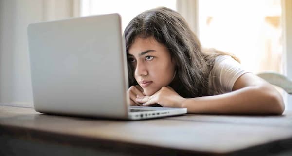 girl looking at laptop